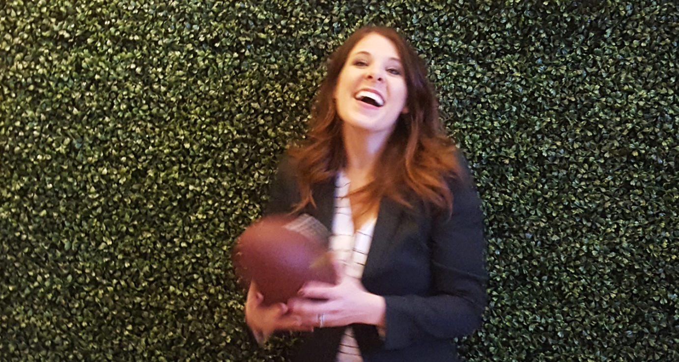 Elizabeth Sherry catches an NFL football