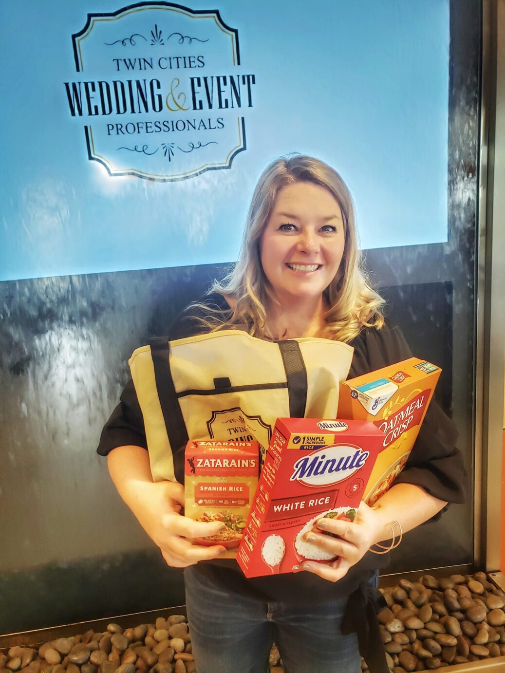 Kellie holds food donations