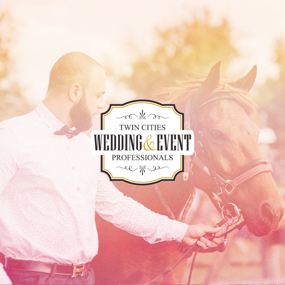Groomsman wearing tie guides a brown horse for wedding