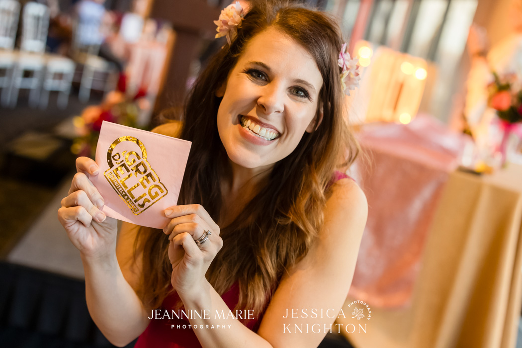 Elizabeth Sherry holding up a napkin with gold foil